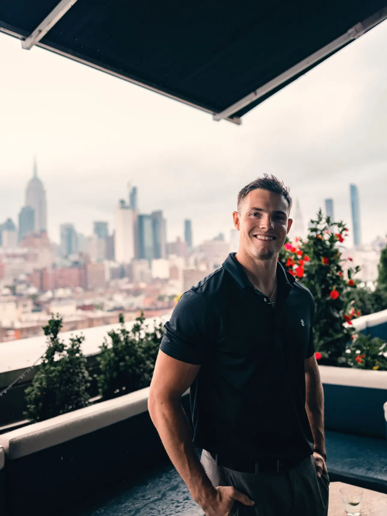 Jonathan on a rooftop above the city